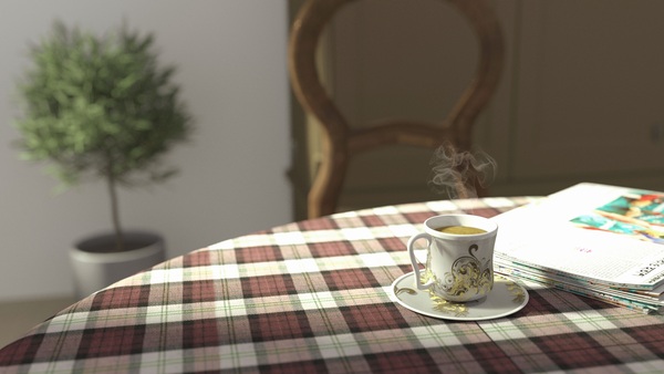 A mug of warm tea on a small table next to a chair
